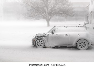 BUFFALO , NEW YORK USA - MARCH 11TH, 2019: Snowy Road. Car Covered With Ice, Snow, And Icicles. Ice Storm Cyclone In Western New York. Winter Frosty Weather.