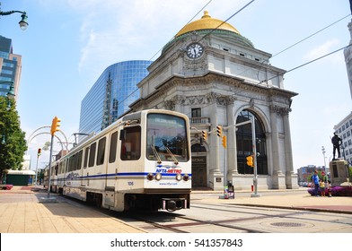 BUFFALO, NY, USA - JULY 23, 2011: Metro Rail in front of Buffalo Savings Bank in downtown Buffalo, New York, USA. Savings Bank is a Beaux Arts style building built in 1899. 