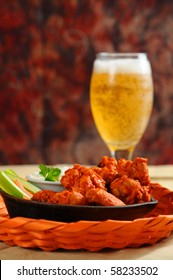 Buffalo style chicken wings served with cold beer.