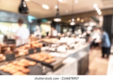 Buffet At Hotel Restaurant Interior Blur Background With Blurry Open Kitchen Counter Bar Of Food Catering Service Business With Chef Staff Cooking For Breakfast, Lunch Or Dinner Meal 