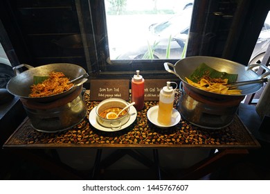 Buffet Station And Self Serve Kiosk Stand Of Fried Papaya Salad And Chicken Wonton (deep Fry Stuffed Dumplings)