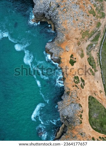 Similar – Aerial Drone View Of Dramatic Ocean Waves Crushing On Rocky Landscape