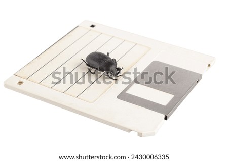 Bug on retro floppy diskette. Computer error concept. Isolated on white background.