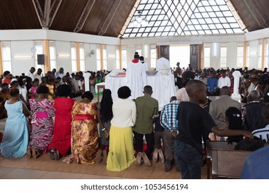 Bugembe (Jinja district), Uganda. 21 May 2017. A Sunday liturgy in the Christ's Cathedral Church. People kneeling after bringing offerings.