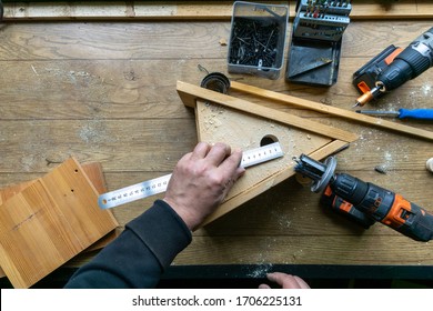 Build Birdhouse, Wood, Screws And Tools Lying On The Bench