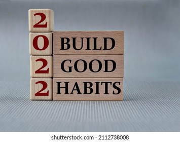 BUILD GOOD HABITS 2022 - Words On Wooden Blocks On Gray Background. Business And Hybrid Working Culture Concept, Copy Space.