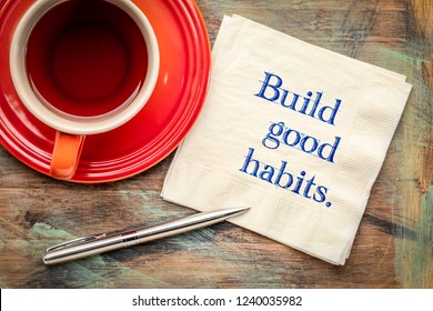 Build Good Habits - Inspirational Handwriting On A Napkin With A Cup Of Tea