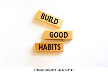 Build good habits symbol. Concept words Build good habits on wooden blocks on beautiful white table, white background, copy space. Business, psychological and build good habits concept.