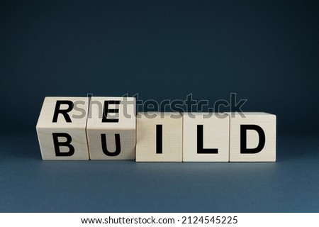 Build or rebuild business concept. Cubes form the word build on rebuild. Time to recover.
