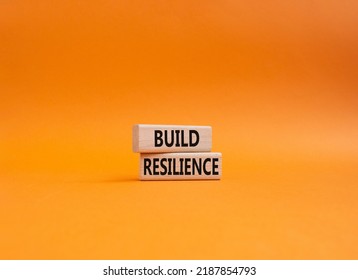 Build Resilience Symbol. Wooden Blocks With Words Build Resilience. Beautiful Orange Background. Business And Build Resilience Concept. Copy Space.