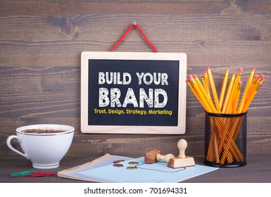 Build Your Brand Concept. Trust Design Strategy Marketing. Chalkboard On A Wooden Background