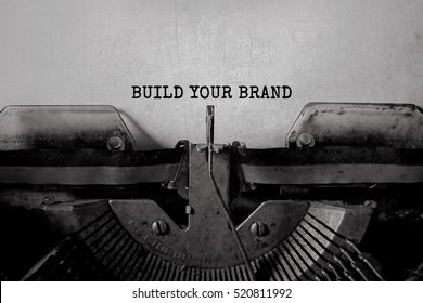 BUILD YOUR BRAND typed words on a vintage typewriter - Shutterstock ID 520811992