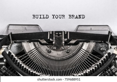 BUILD YOUR BRAND Typed Words On Old Vintage Typewriter. Close Up