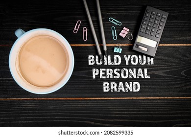 Build Your Personal Brand. Coffee Mug And Office Supplies On A Wooden Background.