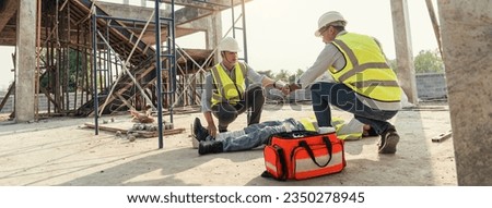 Builder accident fall scaffolding to concrete floor, Safety team help employee accident. First aid worker accident in construction site.