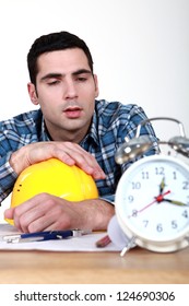 Builder Being Woken Up By Alarm Clock