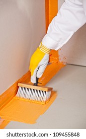 Builder Brush Applied Waterproofing On The Floor Of The Bathroom