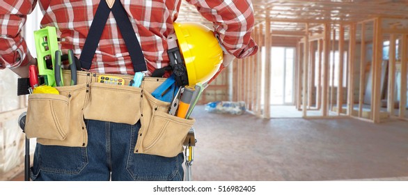 Builder With Construction Tools.