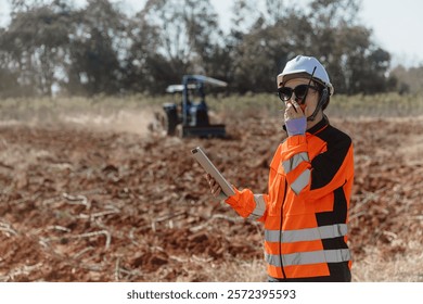 Builder engineer worker outdoor working in construction site wearing safety suit control operate land leveling process for land development
