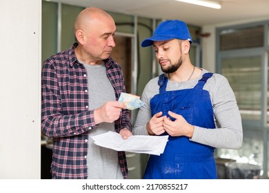 Builder Getting Money For His Work From Construction Manager. Payday, Receiving Salary.