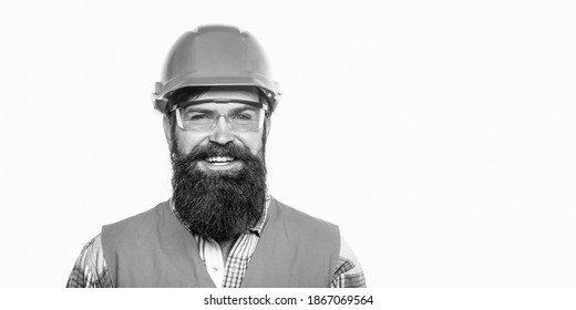 Builder In Hard Hat, Foreman Or Repairman In The Helmet. Portrait Of A Builder Smiling. Black And White.