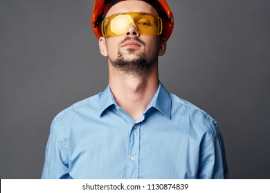      builder in helmet with glasses                           - Shutterstock ID 1130874839