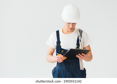 Builder In Helmets On A White Background