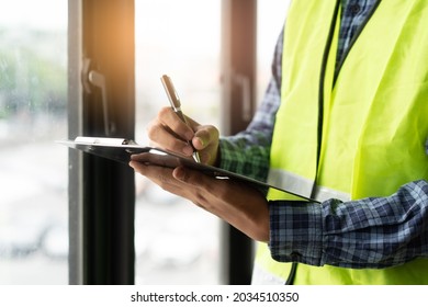 Builder inspection consultancy. Inspector checking material and structure in construction. - Shutterstock ID 2034510350