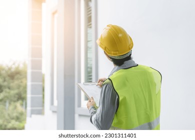 Builder inspection consultancy. Inspector checking material and structure in construction. - Shutterstock ID 2301311401