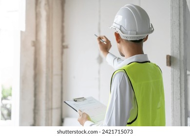Builder inspection consultancy. Inspector checking material and structure in construction.