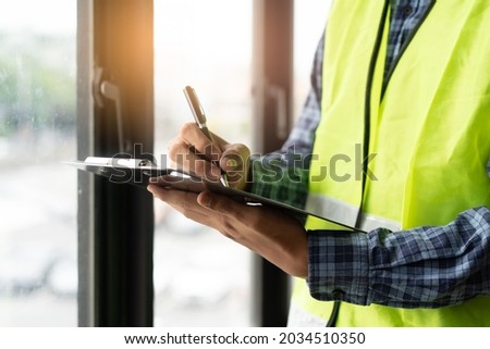 Builder inspection consultancy. Inspector checking material and structure in construction.