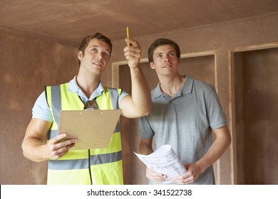 Builder And Inspector Looking At New Property - Shutterstock ID 341522738