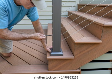 Builder Installing Railing on New Deck - Shutterstock ID 1499983253