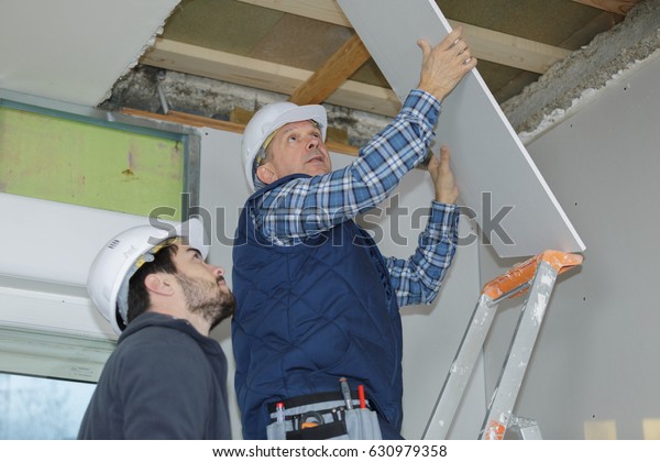 Builder Installing Rest Drywall On Ceiling People Interiors