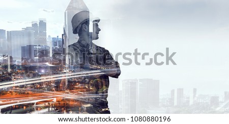 Builder man against cityscape