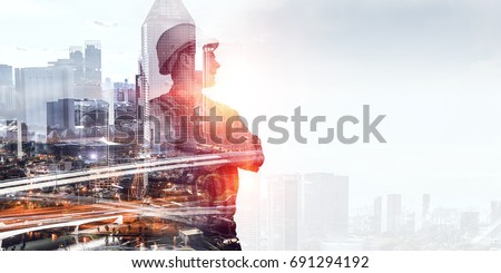 Builder man against cityscape