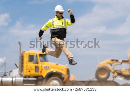 Builder man run fast to work. Engineer supervisor running outdoor. Supervisor jumping. Excited construction builder. Worker jumping at heavy machines. Man engineer running to success. Labor day