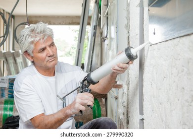 Builder With Mastic Gun