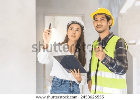 Builder team, foreman asian young engineer, architect man, woman working, discussing construction drawing on clipboard follow project to build industrial plan at house site. Engineering worker people.