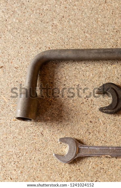 builder tool pair wrenches background auto\
repair work closeup on a light\
substrate
