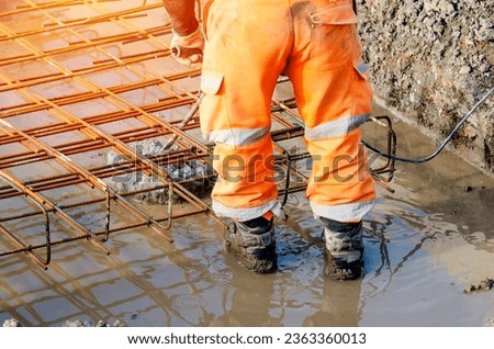 Builder using electric braker fot breaking concrete from the top of pile to fit reinforcement cage on top of it