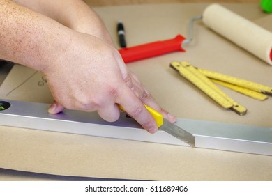 Builder using stationery knife