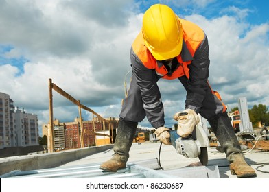 Builder Worker With Grinder Machine Cutting Metal Parts At Construction Site