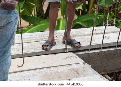 Builder worker man installing cement floor slab panel at building construction site