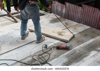 Builder worker man installing cement floor slab panel at building construction site