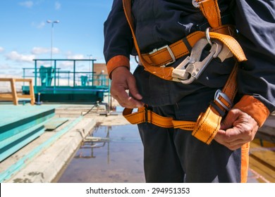 Builder Worker In Safety Protective Equipment On Bridge Construction