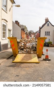 A builders skip containing rubble and bricks from a ongoing home renovation
