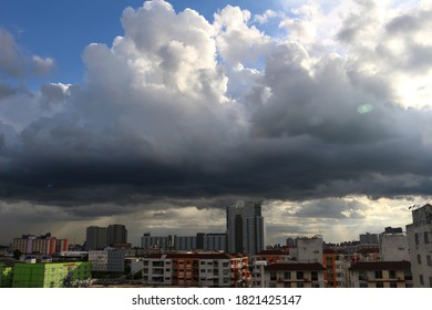 Building and​ condominiums​ with​ a​ dark​ sky​ background​