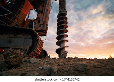 Building activity on contruction site. Close-up view of drilling machine.  