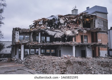 Building Been Torn Down And Made To Small Pieces By The Demolition Team On A Spring Day